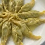 Anolini in brodo aux cailles et à la truffe noire